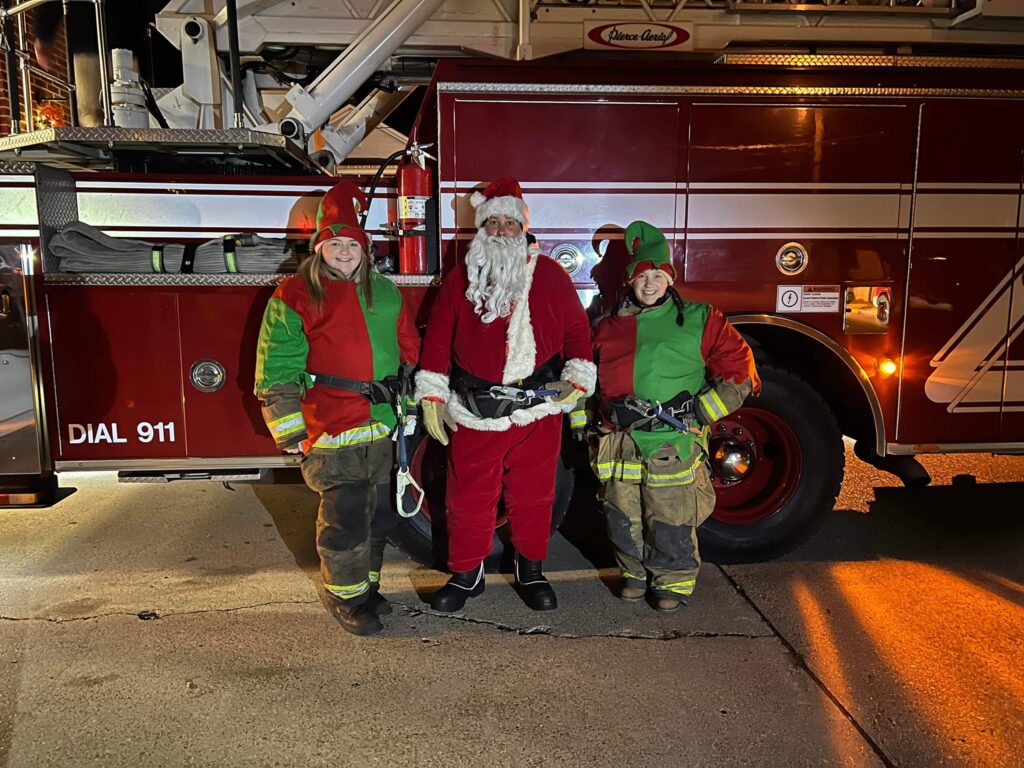 Santa with elves infront of the engine