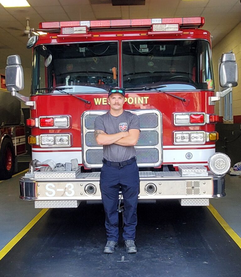 Man standing in front of firetruck